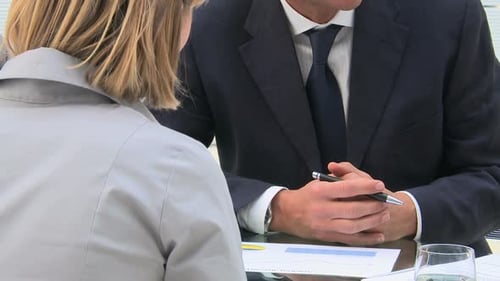 Leadership Working With A Businesswoman In His Office. Happy Businessman Talking And Showing A Bu...