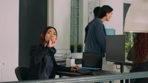 IT Engineer Using Computer and Turning Head to Use Source Code Hologram