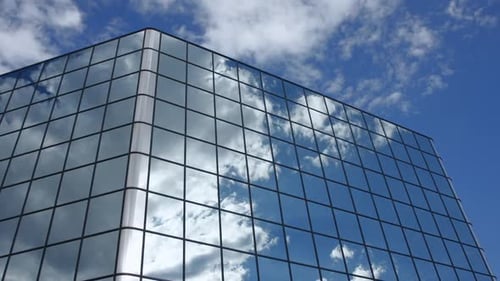 Timelapse of Clouds Reflected in Windows of Corporate Office Building