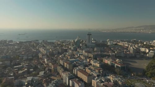 Izmir, Turkey. Aerial View of City Waterfront Buildings, Streets and Aegean Sea Horizon on Sunny Eve