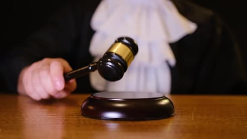 The Judges Gavel Strikes Firmly Symbolizing the Vital Authority Present in Legal Proceedings