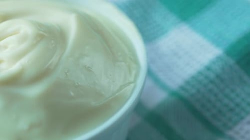 Close Up of Milk Cream in a Container on Table