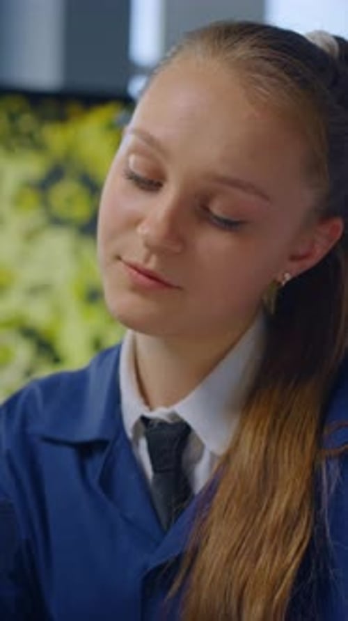 Teen Girl Focused on Science Experiment in Lab