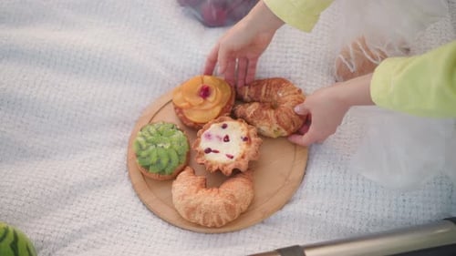 Delicious Pastries Arranged on a Wooden Tray