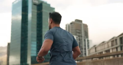 Running, fitness and man with watch in city for marathon training, exercise and cardio workout