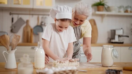 Grandmother and Child Baking Dough Together at Home