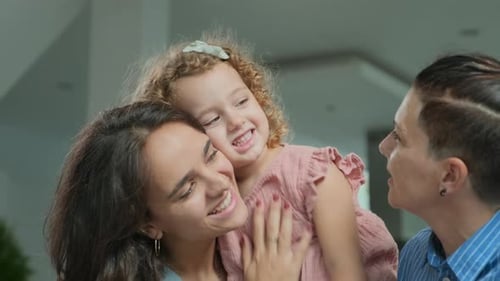 Two Women and a Child Bonding at Home
