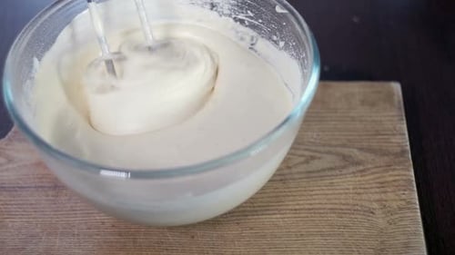 Baker Gets Mixer Whisk From Dough. Mixing Dough with Electric Mixer. Process