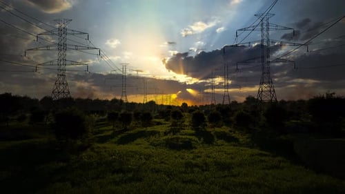 High-Voltage Power Lines At Sunset,High Voltage Electric Transmission Tower