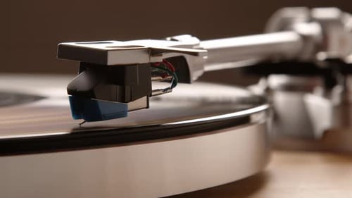 Vintage Record Player Needle on Vinyl Record