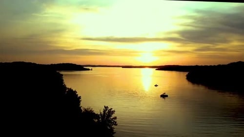 Aerial view of lake at sunset.
