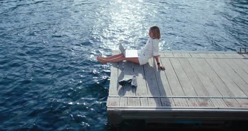 Women with Laptop on the Pier