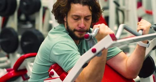 Gym Workout Bicep Exercise Young Caucasian Man Trains His Bicep Muscles in the Gym