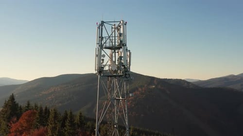 Closeup Aerial View of a Cell Tower Carrying Antennas of Cellular Networks