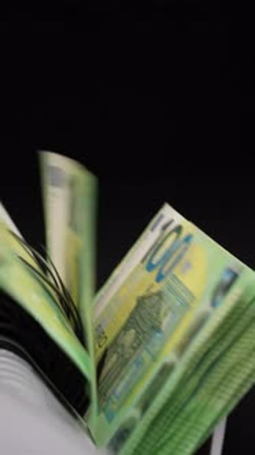 Euro Banknotes Being Sorted in Money Counter Machine