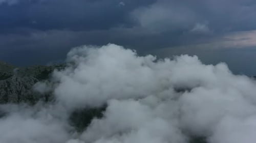 Aerial View of Clouds and Mountains