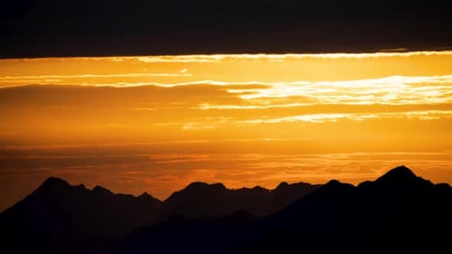 Mountains Landscape at Sunset with Golden Sky