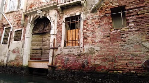 Antique Houses Seen While Sailing On A Gondola In Venice, Italy. POV