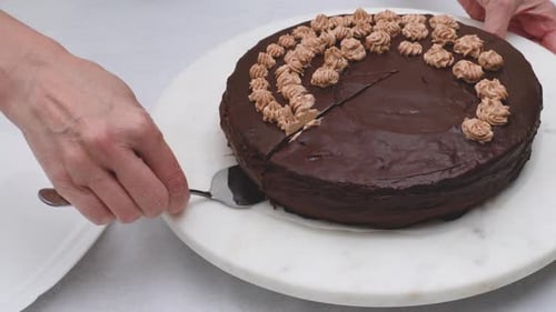Chocolate cake with chocolate cream and chocolate ganache close up.