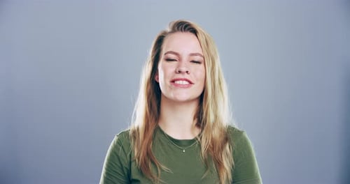 Smiling Woman Making Heart Shape with Hands