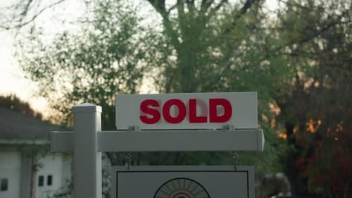 House for sale sold sign outside of real estate property
