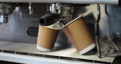 Espresso Machine Dispenses Coffee into Paper Cups