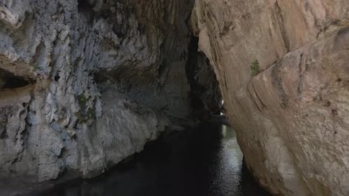 Cave lake exploring, entering crevice in Chiapas, Mexico holiday destination