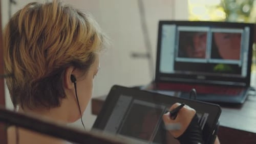 Young Woman Drawing on Graphic Tablet