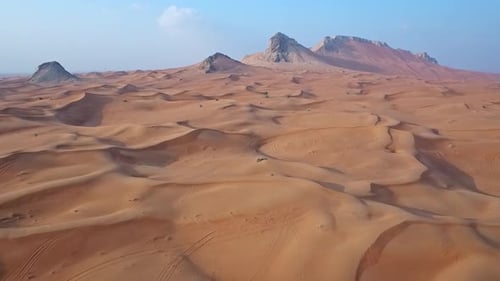 Breathtaking Cinematic Shot of a Remote Desert with Smooth Sand Waves