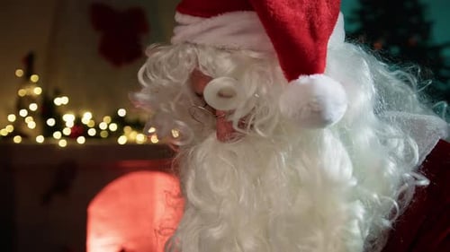 Santa Claus Read The Letters Near The Fireplace In The Office