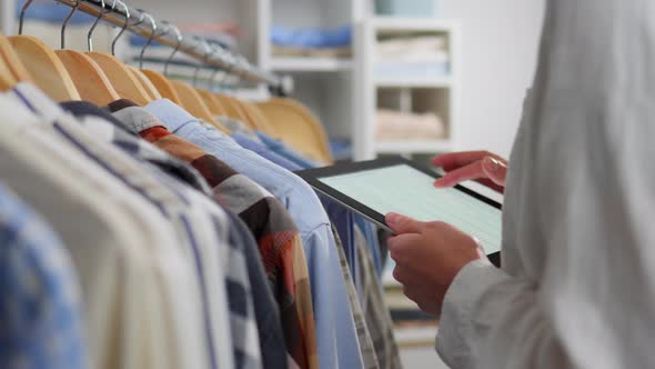 Assortment, Woman In Clothing Store Concentrated Holds Electronic ...