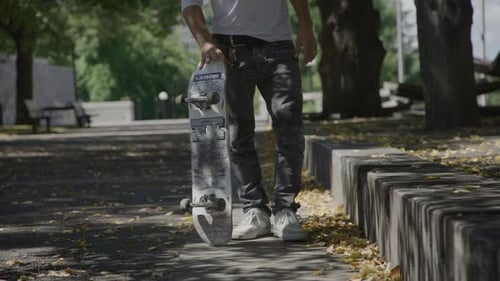 Skateboarder taking off from a stand still on the streets
