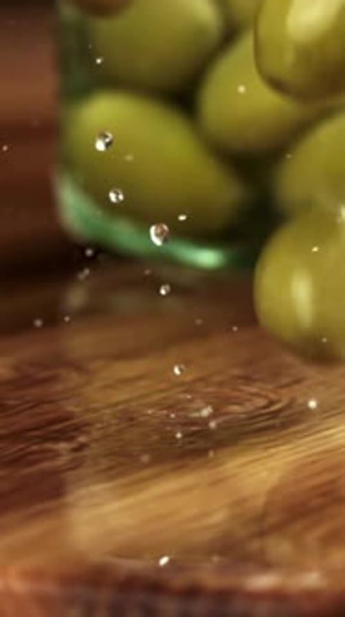 Olives Fall on a Wooden Plank Filmed on a Highspeed Camera at 1000 Fps