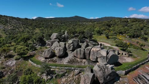 up and down flight with a drone at a granite rock viewpoint with an impressive environment of tree v