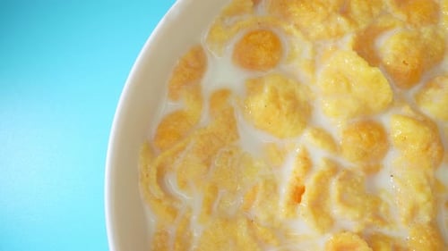 Top view of Appetizing corn flakes mixed with milk