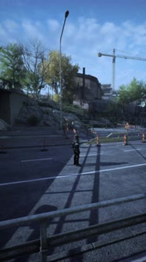 Road Worker Directing Traffic in a Busy Construction Area Under Clear Blue Sky