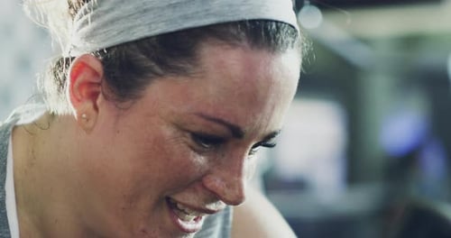 Woman Working Out Hard on Exercise Bike