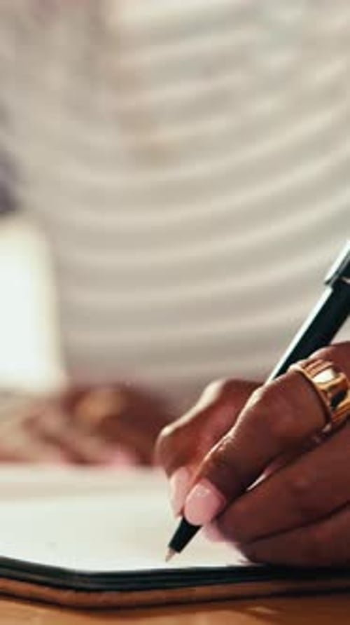 Hand Writes with Pen on Paper in Workplace