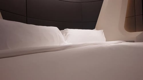 Soft Lighting On The Pillows Of The Bed In The Hotel