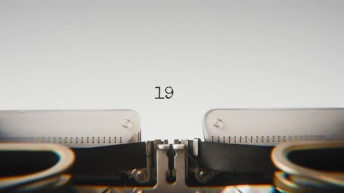 Old mechanical typewriter typing Year 1930 in a close-up view.