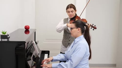 Playing Music in the School Rehearsal with Violin and Piano