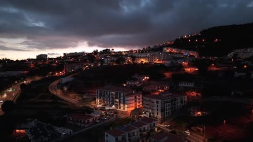 Evening cityscape view houses and apartments on hillside, Portugal