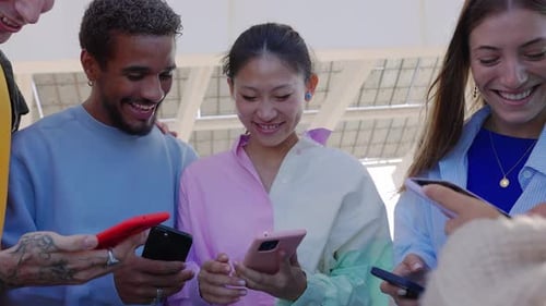 Group of friends using smart phones