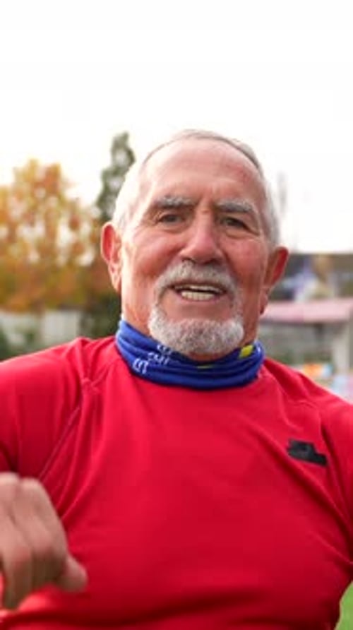 Senior Man Stretching at the Track