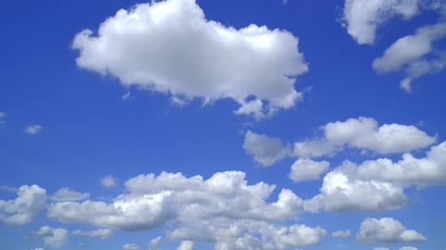 Blue sky with fluffy cloud time lapse on a sunny day 4k footage.