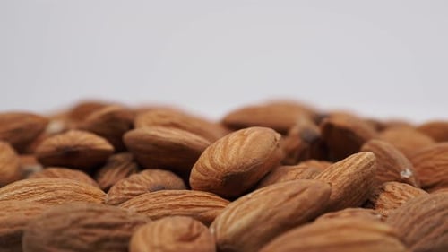 Pile of Healthy Brown Raw Almonds Close Up