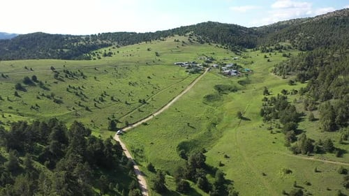 Aerial View Of Trees Green Hills And Highland Houses 2