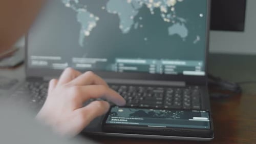 Adult Hands Using Phone With Data Displayed