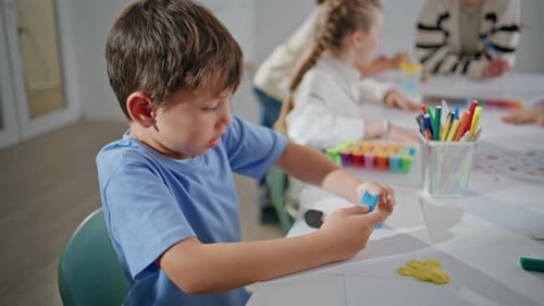 Inspired Pupil Sculpting Plasticine at School Closeup Student Creating Picture