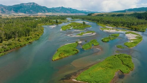Wide View Over Mountain Valley And River Scene On Beautiful Summer Day